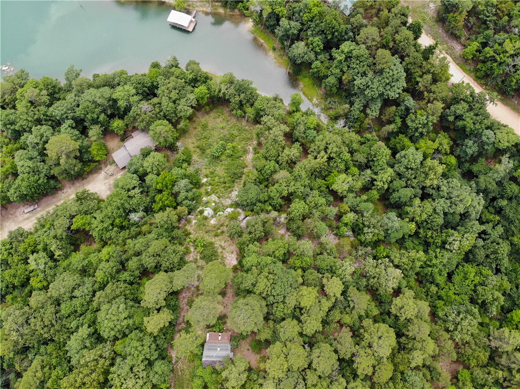 Looking for a Beaver lake get away with Lake frontage,  this is it.  huge rock bluffs with several sites for additional cabins or a building site for a dream home on the lake.  This cabin needs finished out on the inside.
Would not take that much and have a weekend get away.  Almost 6 acres on Beaver Lake.  MUST SEE