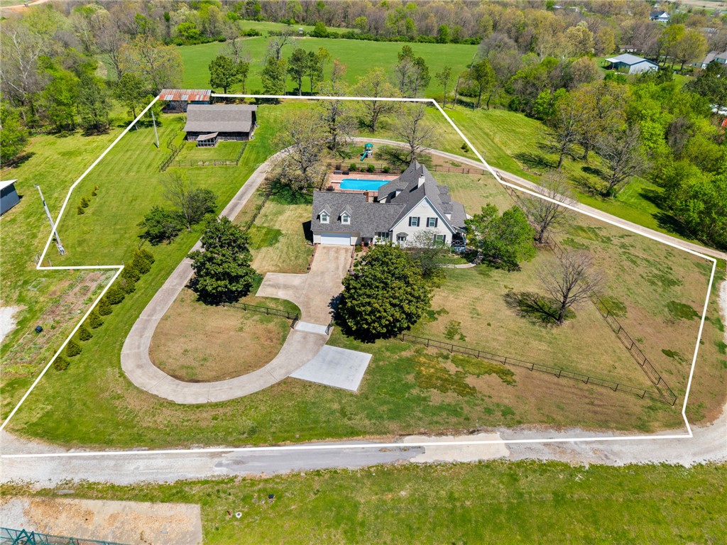 A Fayetteville farmhouse like no other! This dream property rarely comes available and is truly one of a kind. Situated on 3 beautiful acres, this stunning 3,997 sq ft home features 4 bedrooms and 4.5 bathrooms, offering the perfect blend of space, comfort, and charm. Enjoy peaceful evenings on the front porch watching breathtaking sunsets and experience wildlife right in your own backyard. The property also includes a pool and an incredible barn that can be used for storage, hobbies, or animals. The home has been meticulously maintained with numerous upgrades throughout, making it move-in ready for its next owner. Experience the tranquility of country living while being just 10 minutes from everything Fayetteville has to offer—shopping, dining, and entertainment. Come see this exceptional property for yourself!