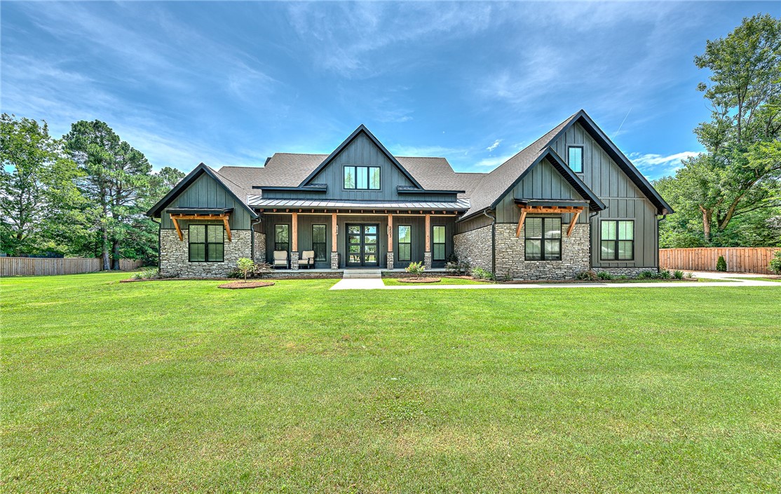 Welcome to this beautiful oasis on the North side of Springdale. Enter the property through automatic rod iron privacy gate, concrete drive to the 3 car garage. Built in 2023, Added pool w/waterfall and 25 x 35 Shop building with 10' double garage door for RV/Boat (multiple outlets with 220).  Walk into this bright open 3200' floor plan with a chef's kitchen, including a hidden pantry with a built-in microwave. Enter the beautiful living area, with an open view to the private backyard, the pool with a waterfall, fireplace/relaxing area and the outdoor cooking area with Bull appliances. The 3 infrared 6000 BTU heaters keeps things cozy in winter. Back inside you'll find the comfort of dual thermostat controlled air, security system, tankless hot water, gas heating system, and even a 5'x7'x5' NWA Storm Shelter in the garage. The Primary suit boasts a beautiful soaker tub and walk-in shower with plenty of space, including the closet! Split floor with a 2nd, 3rd bed and office, and the bonus room is upstairs. Enjoy!