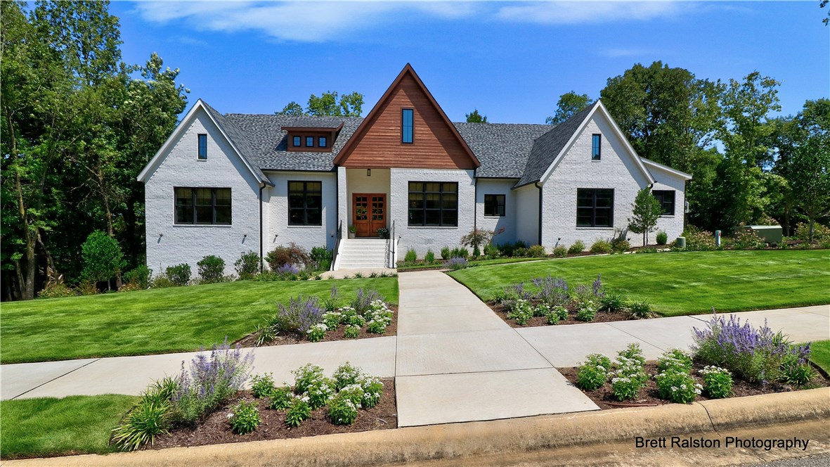 Amazing custom-built, one-owner home with outstanding attention to detail. Home is featured in the latest issue of Arkansas At Home. It is open, airy, spacious featuring large windows, 4 BR, 4.5 BA, upgraded lighting, Bertazzoni stainless KIT appliances, wood floors in living areas & BR, carpet in media room. Second LR/Bonus rm on main level & bonus room on lower level. Quartz & granite countertops in KIT & Baths. Master bath has Slate tile flooring, Porcelain wall tile. Situated at the end of a cul-de-sac, yard is private, gorgeous landscaping & a wonderful place to call Home.