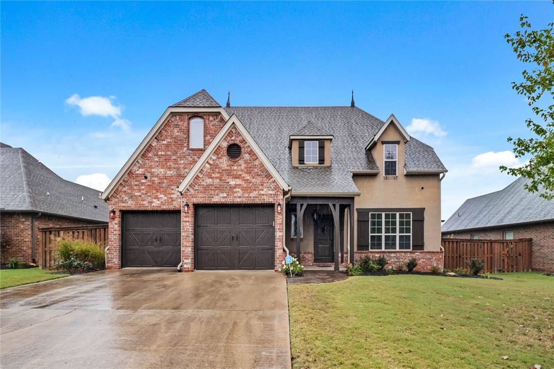 New price on this family friendly Chapel Hill Gem. Enjoy several walking and biking trails like The Greenway and Milk Run Trail then head to the community pool and clubhouse so the kids can swim, play on playground and you can relax. European style with beautiful landscaping and inviting front porch leads you to the brand new hardwood floors throughout living area. Formal living area has large window beaming natural light. Continue to dining room with french doors to outdoor pergola. The modern kitchen is perfect for families with an island, large pantry, cathedral ceiling, nook and opens to another large living area perfect for entertaining. Primary is on main floor with ensuite featuring dual vanities, tiled shower, tub and WIC. Upstairs adds 3 more bedrooms, 2 full baths AND a media room with all components to enjoy family time and watch the game. Flat fenced backyard. Minutes to Crystal Bridges, Amazeum, Orchards Park, Walmart Campus and 2 mins to I49. New roof and gutters Jan 2026.