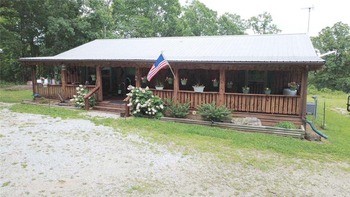 Located in the beautiful Lurton/Pelsor area near the intersection of Highway 123 and Scenic Highway 7, this impeccably maintained 2 bed 2 bath home offers 4 pristine acres, home with beautiful cedar exterior, durable metal roof, and two spacious covered porches that provide the ideal setting for relaxing and enjoying the peaceful surroundings.

Inside, you'll find warm wood floors, central heat and air, and a cozy wood-burning stove. The home is truly move-in ready and comes complete with all appliances. Outside, the amenities continue with a 2 car carport with lights & ceiling fans, an outdoor storage building, and 30-amp and 50-amp RV hookups for guests, a bonus tiny house with electricity. 

As an added bonus, the zero-turn mower conveys with the property, allowing you to immediately enjoy and maintain the beautifully kept acreage. Whether you're looking for a full-time residence, weekend getaway, or investment opportunity in the heart of the Ozarks, this exceptional property checks all the boxes.