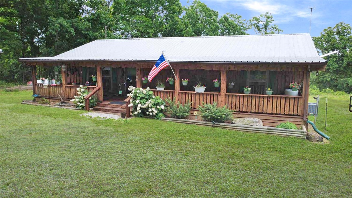 Located in the beautiful Lurton/Pelsor area near the intersection of Highway 123 and Scenic Highway 7, this impeccably maintained 2 bed 2 bath home offers 4 pristine acres, home with beautiful cedar exterior, durable metal roof, and two spacious covered porches that provide the ideal setting for relaxing and enjoying the peaceful surroundings.

Inside, you'll find warm wood floors, central heat and air, and a cozy wood-burning stove. The home is truly move-in ready and comes complete with all appliances. Outside, the amenities continue with a 2 car carport with lights & ceiling fans, an outdoor storage building, and 30-amp and 50-amp RV hookups for guests, a bonus tiny house with electricity. 

As an added bonus, the zero-turn mower conveys with the property, allowing you to immediately enjoy and maintain the beautifully kept acreage. Whether you're looking for a full-time residence, weekend getaway, or investment opportunity in the heart of the Ozarks, this exceptional property checks all the boxes.