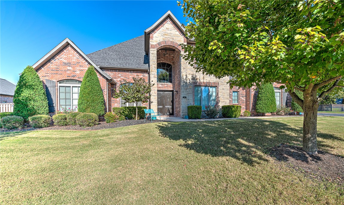 Gorgeous estate home on a 1.01-acre corner lot with a private backyard oasis, tucked behind the gates of the coveted Oak Tree community! This meticulously maintained one-owner home offers 5 bedrooms, 4.5 baths, and a side load 4 car garage w/ storm shelter! Enjoy year-round outdoor living on the covered patio, complete with an inviting fireplace, built-in grill, abundant lush green space, and a stunning heated saltwater pool—perfect for entertaining in style. The main level features a spacious living room with a floor-to-ceiling stone fireplace and vaulted beamed ceilings, a dedicated office with custom built-ins and coffered ceiling, a 2nd office/living rm, and a chef’s eat-in kitchen with center island, double ovens, gas cooktop, and walk-in pantry. Luxurious main level master retreat plus twp additional bedrooms on the main level that share a large full bath w/ dual sinks. 2nd level hosts large bonus room, media room, 2 bedrooms each with an en suite bath and AMAZING storage space! Great community amenities!