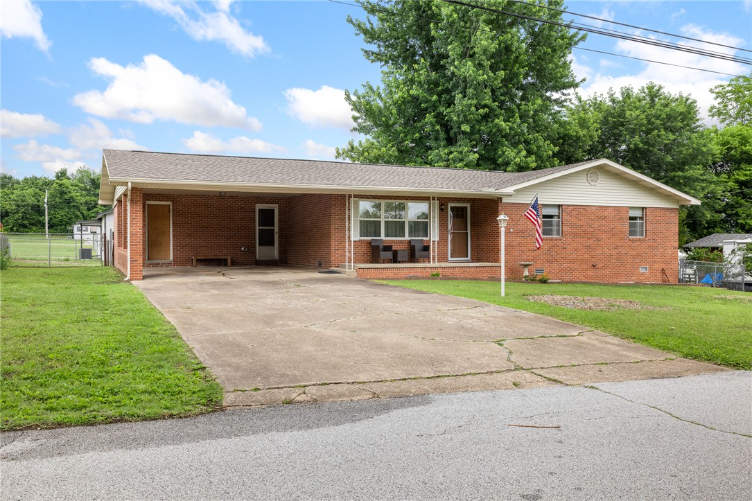 Charming all brick 3 bedroom home within the heart of Harrison.  This property features beautiful hardwood floors, custom kitchen cabinets, updated appliances, a new roof, storage shed, large utility room with 1/2 bath and tons of updates.  The spacious fenced backyard offers plenty of room for pets, kids, gardening or just hanging out.  If you have a green thumb you will definitely love the raised beds. This won't last long so call today!