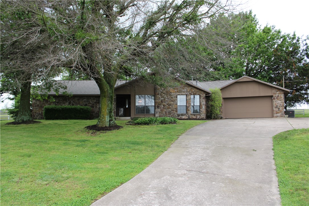 20.33 ACRES IN TONTITOWN!!! This property has already been subdivided into 6 different parcels between 1-5 acres each. This property also has great development potential. The home was built in 1987 and features 2,821 sq ft, 3 bedrooms, 2.5 baths, and 2 car garage. This house is perfect for entertaining with 2 living areas, 2 dining areas, bar area, and large sunroom. The exterior back patio off the sunroom and another off the master suite are perfect areas for relaxation. In true Tontitown fashion, there is a large grape vineyard on the Northwest corner of the property. Come check out this property before it is SOLD!