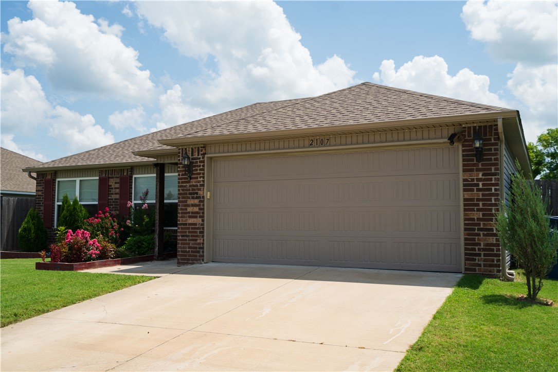 Ready for a stunningly maintained home? Step right up to 2107 N Lexington St. This 2020 build is located on the North side of Siloam Springs, just off of N Mount Olive. With 3 Bedrooms and 2 baths in a 1300 Sq. Ft  footprint, lots of upgraded interior space await. This home has a Ton of great features including open concept kitchen and dining area, fresh paint, upgraded LVP, and granite countertops throughout the house including the window sills, it has an added touch of elegance to the interior. The 2 car garage has a integrated 10-12 person capacity storm shelter built into the floor for added peace of mind. And the backyard does not disappoint with reinforced steel tubing on the fence doors, and a beautiful garden with fresh vegetables ready to pick, and a mature blackberry bush ready for picking this is not one you want to miss!