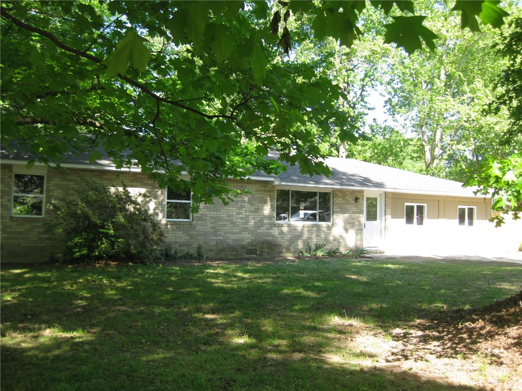 Super nice redone home in the heart of Rogers. 2,044 sq. ft., 6 bedrooms, 2 baths. Completely redone with new paint, carpet, countertops, roof, light fixtures. Fenced backyard with huge trees. Great location in a nice area.