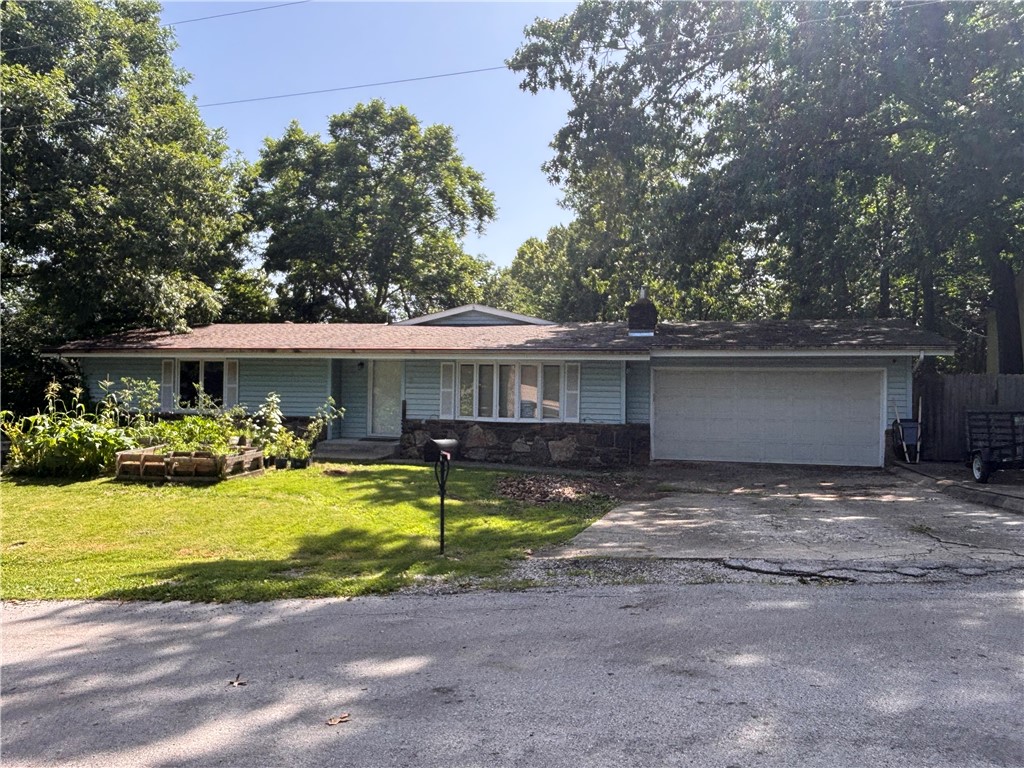Opportunity is knocking on Pembroke Drive! Located in one of Bella Vista's most recreation-rich areas, this property offers an outstanding opportunity for investors, remodelers, or do-it-yourselfer's. The home features a large living room and second living room as well as a bonus room in the basement with an attached bath. This home needs work so if you are searching for your next project, or long term investment this home may be what you are looking for. Location is everything and this property delivers. Close to Windsor lake, this home is just minutes from some of Northwest Arkansas' most sought after outdoor destinations such as the new OZ trails bike park as well as nearby access points to the mountain biking network of trails including the Back 40 Trail Head and the extensive Little Sugar Trail system. Bring your imagination and your vision, this property is being sold “AS IS”. Because sometimes the best homes aren't the finished ones, they are the ones waiting for the right person to make them their own.