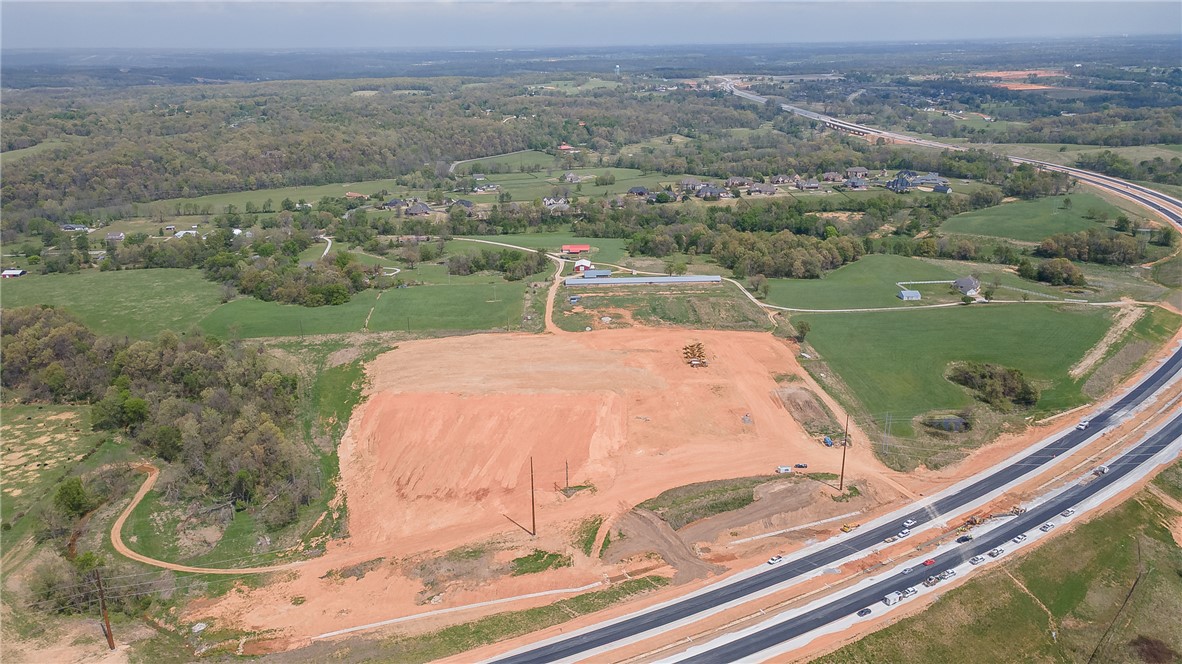 Rare find on 52.26+/- acres with upper portion of property on city sewer. Property runs behind Churchill Downs and up to the new 612 extension. Great opportunity to develop a subdivision with estate lots or residential homes. Property has 2 homes on it that will be sold as is.