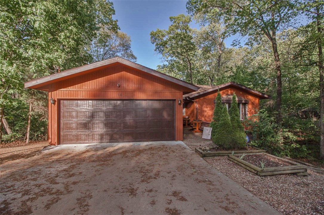Your future home is located just within 6 min from 71/I-49 and minutes from Lake Windsor! Home features wood siding exterior with an inviting front porch and deck to enjoy your view of trees on! Interior: spacious living room with vaulted ceiling, fireplace & recently upgraded wood flooring, breakfast area,kitchen with stainless appliances, peachtree window casing throughout, master suite with bay window, unfinished basement great for future media room or storage! New garage door!