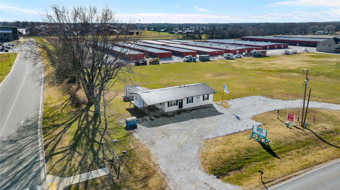 Zoned C2 - 1 1/2 acres commercial. Great Investment opportunity with so many possibilities.  Property is located next to the Pea Ridge High School on Hwy 94 and the FREEUP Storage Buildings are on the West Side. Current 1148SqFt Building was updated inside and new vinyl installed on the outside in 2021, Electric ran underground to the house. Property has 2 entrances making for easy entry and exit. Perfect location for a New Business Development. Agent Owned. Call for details.