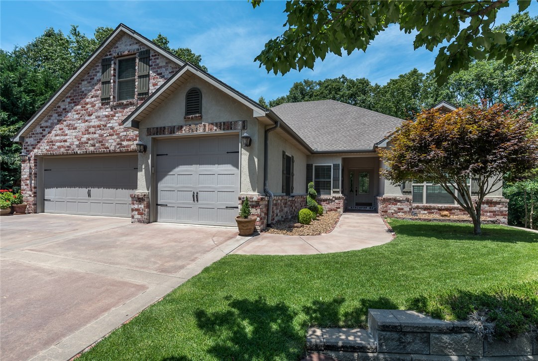 Gorgeous Bella Vista home in excellent location! Secluded cul-de-sac. Easy access to Hwy 71 and located close to golf courses, pool, tennis, and other community amenities.  Spacious interior layout with hardwood floors and lots of natural light.Large kitchen open to living room and a formal dining room create the perfect entertaining space. Kitchen features granite counters, stainless appliances, bar area, and large island with counter seating. Covered deck and patio provide a great outdoor living space. Finished basement has a wet bar, and plenty of space for both media room and game room. This home's location has curbed streets, underground utilities, and sewer. This home is a must see!