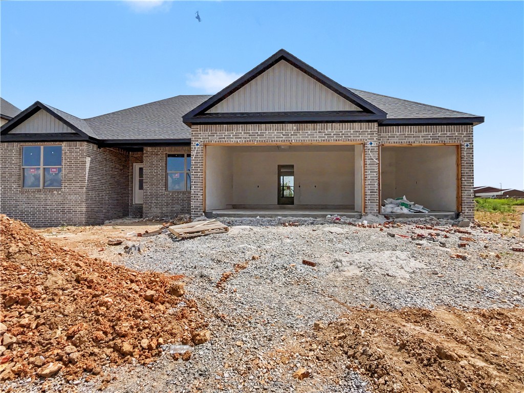 Experience the Marvin plan at Spring Creek Farms. This modern community will feature a community pool, playground and walking trails. The Marvin Plan offers refined single-level living with a thoughtfully designed 4-bedroom, 2 bath layout that blends comfort and sophistication. The open-concept design is enhanced by soaring vaulted ceilings accented with beams, and electric fireplace. The kitchen is beautifully appointed with custom soft-close cabinetry extending to the ceiling, a gas range, fully vented hood, and built-in microwave—perfectly balancing style and functionality. The primary suite is a serene private retreat, featuring a a tray ceiling in the bedroom and a luxurious walk-in shower for a true spa-like escape. A 3-car garage and a large covered patio with gas and ethernet hookups complete this thoughtfully crafted luxury design