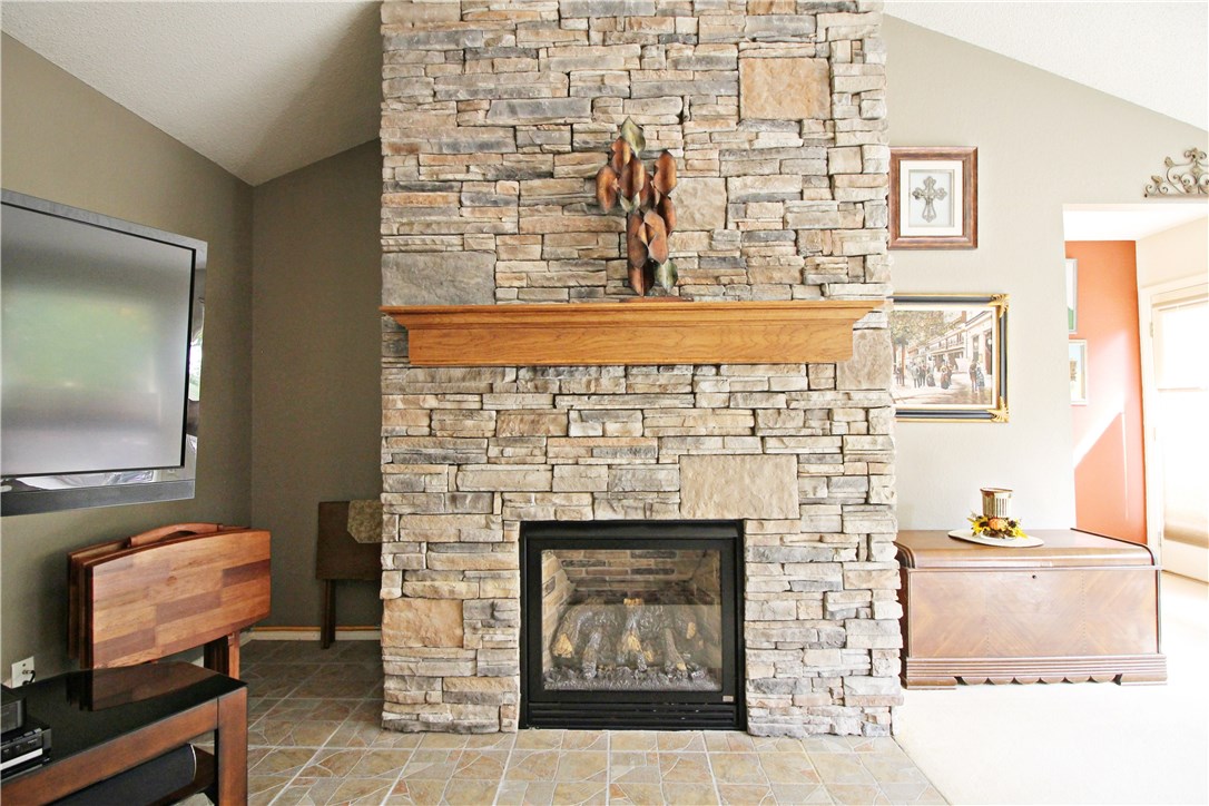 NEW roof 2013 & HVAC 2017! Lovely spacious town home upgrades! Stone tile floor entryway, kitchen, & master bathroom. Master bath has custom cabinets, vanity, & walk-in shower with rain head. Kitchen has Corian counters & custom hickory wood front cabinets. Living room has stunning custom stone fireplace & wall of windows with top down/bottom up blinds for great natural light. Huge patio! Enjoy Bella Vista's amenities without yard work! Near Riordan Rec Center, Kingsdale tennis, pool, Pappa Mikes, & golf!
