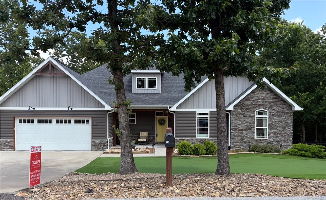 You don't want to miss this beautiful custom-built 3-bedroom, 2-bath home tucked away on a quiet street in Bella Vista and situated on a spacious double lot. The low-maintenance front yard features a turf putting green that provides year-round curb appeal. The private backyard includes a fire pit and backs to POA-owned land, offering wooded views and no homes directly behind. Oversized double doors open to the deck, creating seamless indoor-outdoor living with peaceful treehouse views. The walk-out crawl space with a concrete pad offers endless possibilities for storage, a workshop, home gym, office, or hobby space (buyer to verify use). The oversized 2-car garage provides additional room for a workbench or projects. Located just minutes from Lake Loch Lomond, this home combines privacy, flexible space, and easy access to one of Bella Vista's premier lakes.  Included with your POA membership  gives you access to 7 private lakes, 7 golf courses, 3 top of the line fitness centers and many more amenities.