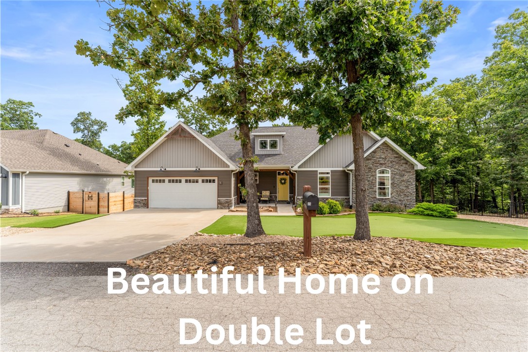 You don't want to miss this beautiful custom-built 3-bedroom, 2-bath home tucked away on a quiet street in Bella Vista and situated on a spacious double lot. The low-maintenance front yard features a turf putting green that provides year-round curb appeal. The private backyard includes a fire pit and backs to POA-owned land, offering wooded views and no homes directly behind. Oversized double doors open to the deck, creating seamless indoor-outdoor living with peaceful treehouse views. The walk-out crawl space with a concrete pad offers endless possibilities for storage, a workshop, home gym, office, or hobby space (buyer to verify use). The oversized 2-car garage provides additional room for a workbench or projects. Located just minutes from Lake Loch Lomond, this home combines privacy, flexible space, and easy access to one of Bella Vista's premier lakes.  

Kitchen refrigerator and washer and dryer to convey.  Dehumidifier in crawl space does not convey with the sale of the home.