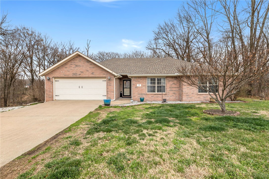 Welcome home to this spacious double lot in a quiet corner of Bella Vista! 49 Taransay Circle feels like home in the country with access to all of the amenities of Bella Vista. PLUS, a quick hop to the Bypass and you're right in Bentonville or Rogers! With upgrades like granite countertops, luxury vinyl plank flooring, Trex decking, and a brand new garage door, all that's left to do is sit back on the deck and relax!