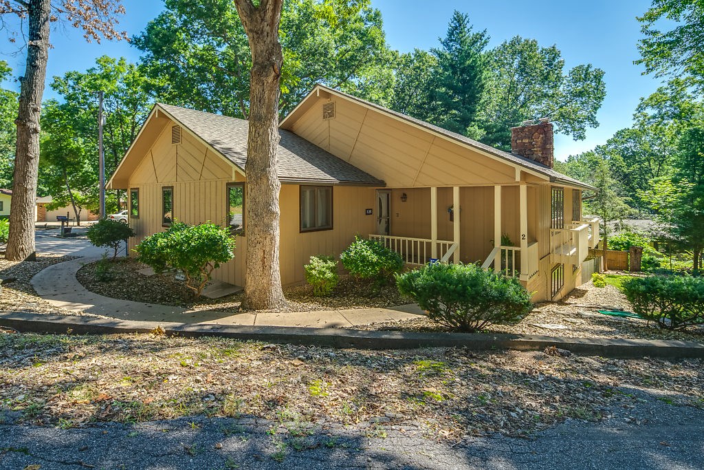Fantastic home in a great location. Down the street from Kingswood Recreation area which includes pool, playground & golf course. Also down the street from the new bike trail, Back 40.. There are 2 living areas, one on each level with wood burning fireplaces. Granite countertops in the updated kitchen along with 2 ovens(one convection). Enclosed sunroom. Large bonus area that would be great for a shop, game room, craft room, etc. 692 sq ft not included in the sq ft. Also, wine cellar room. The downstairs could be a great mother-in-law quarters.