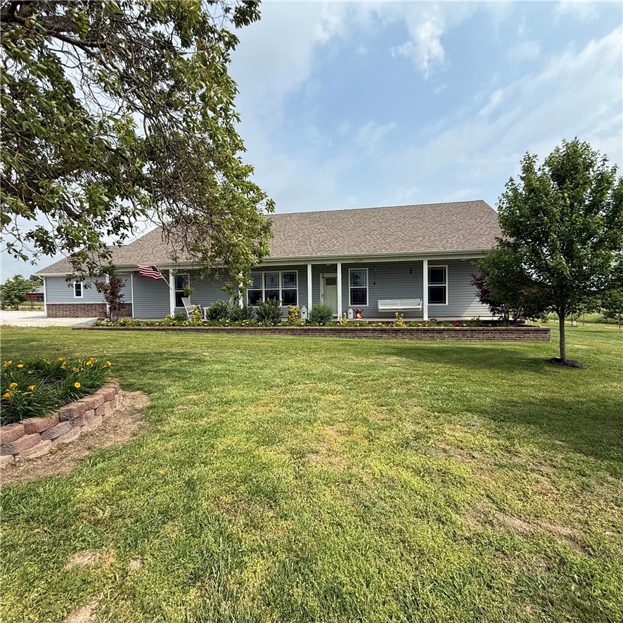 This amazing 10 acre property is ready to move in! Built in 2020, 3 bedroom and 2.5 bath home is 1984sf, comes with a metal shop, with a shed for tools and livestock barn and corral area. Pond that is stocked(bass, bluegill, and catfish). Pond is shared with neighbor. Fruit producing trees on property. Wonderful views all around. Well maintained the owners thought of everything. Within the city limits of Highfill. Comes with Vivint security, on monthly plan. Plant with red ribbon  in the back yard will not stay and the swing on the front porch will not stay. See attachments. Wheelchair accessible through garage and all doors are 36 inches wide. Storm shelter in home. Features two primary suites, each complete with its own dedicated, private bathroom.