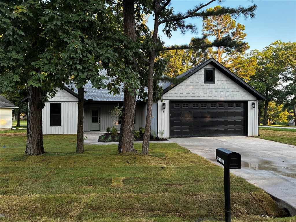 New construction opportunities offering both golf course views and Table Rock Lake access are rare in Holiday Island! Located behind the 3rd tee box of Holiday Island Golf Course and just 2 miles from Holiday Island Marina, this move-in ready split-bedroom 3 bed/2 bath home delivers the lifestyle buyers are searching for. Inside, enjoy an open-concept design with a brick gas fireplace, quartz countertops, LG stainless appliances, gas range, walk-in pantry, LVP flooring, curated lighting, and luxury finishes throughout. The private primary suite is thoughtfully separated from the guest wing and features a walk-in closet, ensuite bath, soaking tub & laundry access. Thoughtful upgrades include 8" baseboards, tall-framed windows, a drop zone, 4' x 10' garage storage room, attic storage, tankless water heater, spray foam-insulated interior walls, gutters, a 500-gallon propane tank, and covered front & back porches. Receive $2,500.00 towards buyer's closing costs when working with the builder’s preferred local lender!