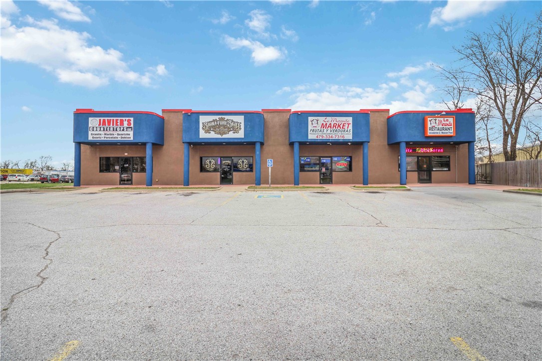 Prime value-add retail investment opportunity in Springdale! Located on E Robinson Avenue (HWY 412), this property offers excellent visibility along a high-traffic main road and features 4 individual retail units. Ample on-site customer parking is available, and the property benefits from a strong 26,000 daily traffic count for maximum exposure. The flexible layout is ideal for a variety of businesses (currently a granite showroom, tattoo shop, grocery store, and restaurant), and its strategic location places it close to thriving local shops, restaurants, and residential neighborhoods. Springdale is one of the four major cities in Northwest Arkansas (600,000+ metro population). The city’s rapid growth makes commercial retail space a prime investment. Roof was replaced in 2022, and the building was constructed in 2007. Modified Gross Lease – landlord pays taxes, insurance, garbage, lawn care; tenants cover utilities and interior expenses.