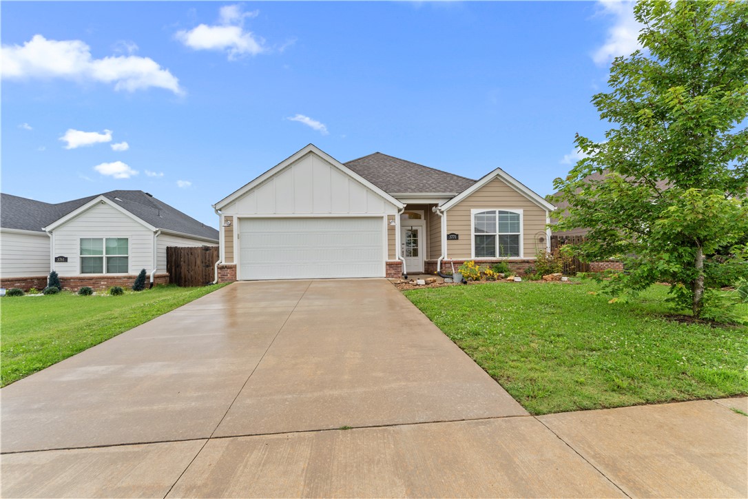 This pristine, turn-key 3-bedroom, 2-bathroom home features durable luxury vinyl plank flooring throughout a highly functional layout. The immaculate interior includes a kitchen equipped with granite countertops and upgraded stainless steel appliances, seamlessly connecting to a primary bedroom with an elegant tray ceiling. Energy-efficient low-E windows brighten the living spaces, while covered front and back porches offer excellent outdoor relaxation areas. Best of all, you are located just one block from Springdale’s popular C.L. "Charlie" & Willie George Park, putting a premier splash pad, dog park, and sports fields practically in your backyard. **New Roof 2026**