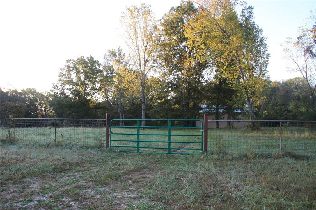 Bring your dreams to this 4.58 acre level, fenced property just 2.5 miles from Bull Shoals Lake and less than 5 miles to White River! With no restrictions the possibilities are endless-build your home, set up an RV or tiny house, or start your hobby farm. The land features a 40x44 barn, and utilities already in place-including septic, power, and water, saving time and money.  Plenty of space for livestock, gardens, or lake/river toys, all in a quiet country setting just minutes from fishing, boating, and outdoor recreation.  Don’t miss this rare find, acreage with infrastructure this close to both the lake and river doesn’t come around often!