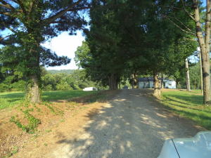 Lots of opportunity! 10 acres with 1650 sq ft home with 4 acres fenced and graveled.