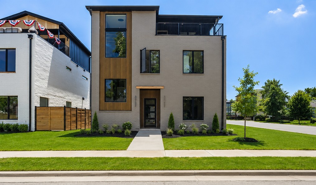 Located less than a half mile to the Downtown Square.  This Luxury Modern home features premium, unique touches throughout. Luxury vinyl flooring, quartz counters, custom cabinetry and eye-catching woodwork. Thoughtfully designed for both everyday living and upscale entertaining. Main home is 3,155sf with 4br/4.5ba plus an office and a third floor family room and wet bar with rooftop deck access. Detached garage apartment adds an additional 525sf with living room, full kitchen, bedroom and bathroom. Built in natural gas grill. Wired for video and sound. Built with energy efficiency in mind. Open-cell foam spray insulation and high efficiency a/c. Plans and appraisal sketch attached in MLS or available upon request.