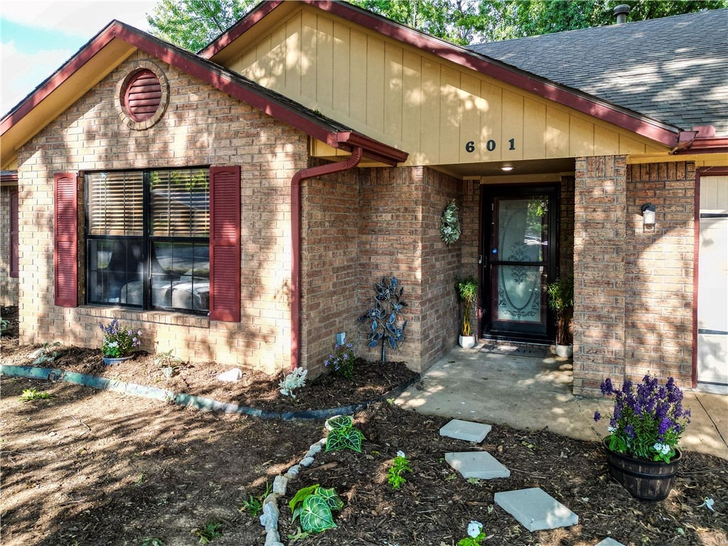 Welcome to 601 Garland Place in Lowell, Arkansas! Nestled in a charming, established neighborhood, this home offers a warm and inviting setting surrounded by mature trees and a peaceful residential feel. The location provides a wonderful balance of comfort and convenience, with easy access to nearby schools, shopping, dining, and everything Northwest Arkansas has to offer.

From the moment you arrive, you’ll appreciate the character of the neighborhood and the welcoming curb appeal. Whether you’re enjoying a quiet evening at home, spending time outdoors, or taking advantage of the central Lowell location, this property is a great opportunity to enjoy an established community in the heart of NWA.