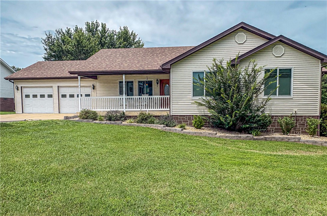 Well-maintained 3-bedroom, 3-bath home offering approximately 2,400 sq ft on nearly an acre. This versatile property features a finished basement, abundant garage space, and a standout 38' x 40' insulated shop with a 12' lean-to, providing exceptional room for equipment, RVs, boats, hobbies, or a workshop. The spacious lot offers privacy and outdoor enjoyment while remaining convenient to Harrison amenities. Whether you're looking for extra storage, workspace, or room to pursue your passions, this property delivers a rare combination of comfortable living and functional utility.