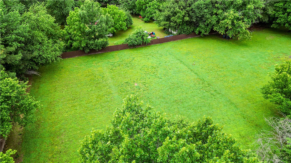 Rare opportunity to own 1.29 level, buildable acres in a private, partially wooded setting. This beautiful homesite includes a fully finished shed with electricity and air conditioning, perfect for a workshop, studio, office, or additional storage. Enjoy the privacy of a wooded setting while remaining just minutes from Fayetteville, The Blessings, shopping, dining, and I-49.
