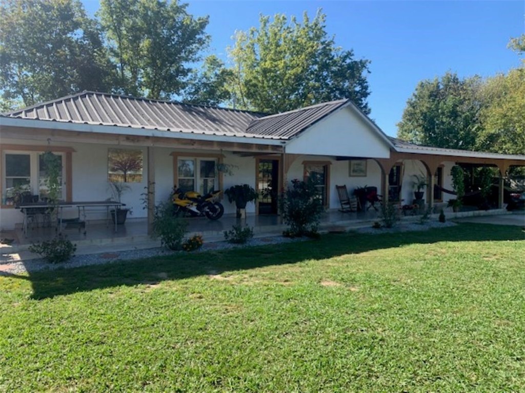 Its a New Year!  Time to invest in a great home with land.  This property has many opportunities!  Beautiful 4-bedroom home, large 2400 sq ft shop/building, plus an additional 950 sq ft house that being restored.  Enoy the large front porch as you relax watching the grazing cows, Retire to the oversized primary bedroom.  2091 sq ft in the main house, 2400 sq ft outbuilding and a 950 sq ft house.  All included Sold "as-is", Beautiful property, come take a look!  Seller is willing to sell the shop and front house separately.