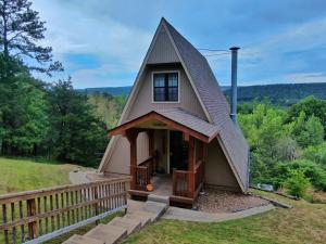 Take a look at this!! Make this your home or a weekend get-a-away.  This beautiful home offers almost 11 acres with a year-round creek in your backyard.  Inside you'll find three bedrooms, one and a half bathrooms with walk-out decks to take in the mountain views.