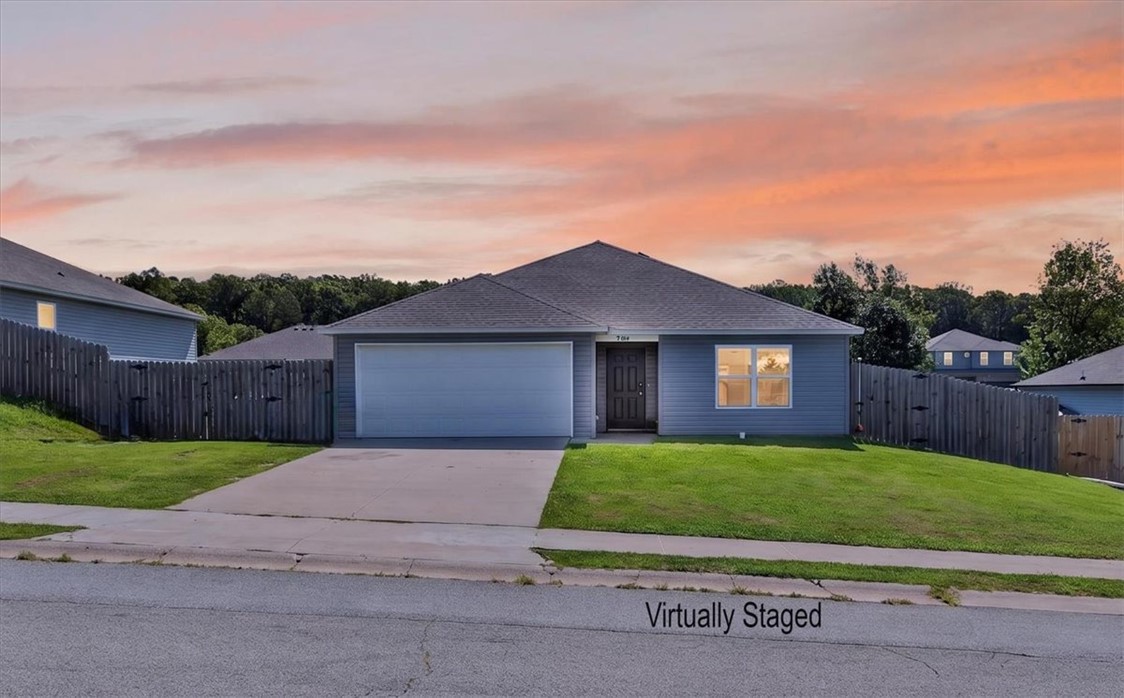 This inviting 3-bedroom, 2-bath home combines comfort, style, and efficiency. Inside you'll find LVP flooring, granite countertops, and an electric fireplace that creates a cozy focal point in the living area. The refrigerator, washer, and dryer all convey, making moving in a little easier. Step outside to a spacious, nearly ground-level deck that's perfect for cookouts, gatherings, or simply unwinding after a long day. Raised vegetable beds and beautiful sunflower gardens add color and charm to the backyard. Best of all, the home features owned, paid-off solar panels, offering long-term energy savings with no lease to assume.