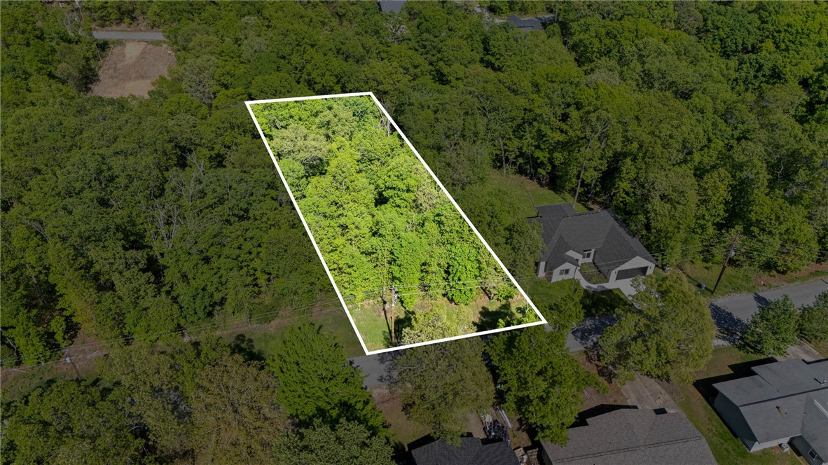 Build your dream home on this stunning .32 acre lot! Beautifully wooded with privacy and located in the Suffolk Subdivision, this lot is close enough to I-49 while still feeling secluded. Less than a mile from Back 40 Trail access and less than 6 miles from the OZ Trails Bike Park, as well as just a few miles from Metfield Recreation Area, this lot is right in the middle of all that Bella Vista has to offer. Bella Vista POA amenities include miles of mountain biking trails, 7 golf courses, 7 lakes, and fitness centers/pool. Do not miss this incredible opportunity!