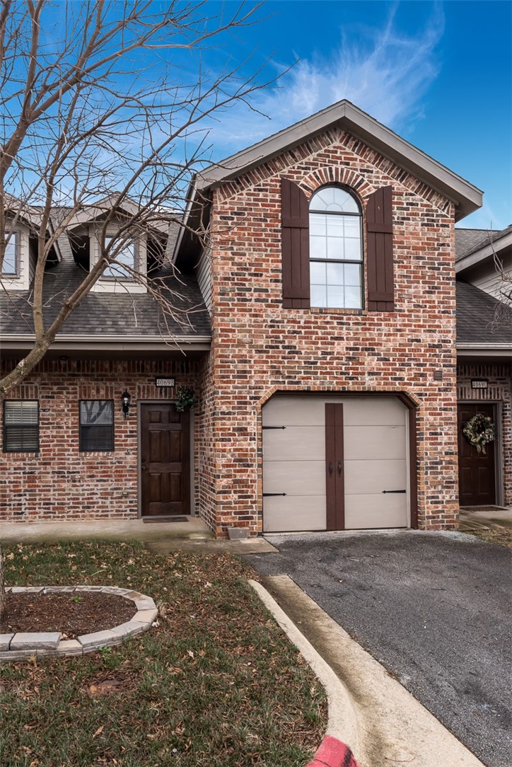 Beautiful European style townhome in excellent location! Centrally located with easy access to I-49 for short travel to all the best NWA has to offer. Close to shopping, dining, and entertainment. Private and quiet community. Townhome features garage parking. This home welcomes you inside with a vaulted entryway and stairway to second story. Entryway leads into the kitchen and dining area that is spacious for entertaining. Pantry adds storage space. Large living room has fireplace and built-in entertainment alcove. Backyard is privacy fenced and has patio for outdoor living space. Upstairs is Master bedroom with walk-in closet and attached bath. Guest bedroom upstairs also has attached bath. This unit is a must see!. All Kitchen appliances, lawn care and trash pick up are included.