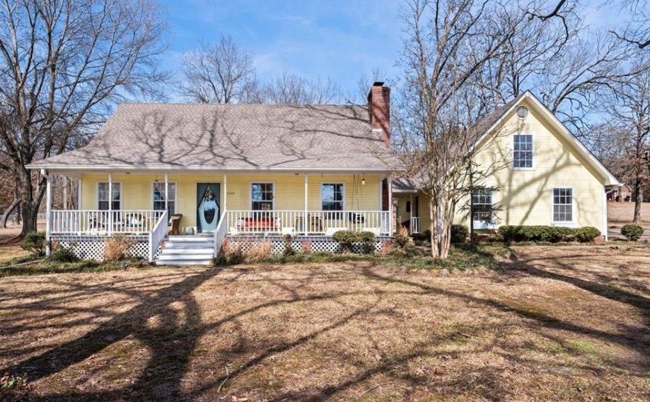 Welcome to this warm and inviting farmhouse cottage set on 1.64 acres in a scenic, peaceful neighborhood. With just over 2,400 heated sq ft, this 3-bedroom, 2.5-bath home offers a comfortable layout for everyday living and a quiet retreat. The primary suite on the main level provides convenience and privacy, while two additional bedrooms and a full bath upstairs offer flexible space for guests, family, or a home office. Plantation shutters throughout the main level add timeless character and enhance natural light. The kitchen features updated quartz countertops and a practical layout that flows into the main living spaces. Recent improvements include a new hot water heater (2023) and roof and gutters completed in 2021. Additional highlights include a 2-car garage connected by a breezeway and a 16x24 powered outbuilding, perfect for a workshop, storage, or hobby space. The back deck, built in 2023, is ideal for entertaining, relaxing, or enjoying the night sky in a peaceful, park-like setting.