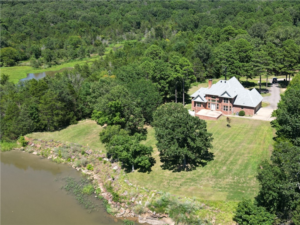 Custom-built and full of amenities, this stunning 2-story home offers 4 bedrooms, 3 bathrooms, and approximately 2 acres on the banks of the Arkansas River. Designed with comfort and functionality in mind, you'll find spacious living areas, quality finishes, and thoughtful details throughout. Enjoy beautiful river views, room to spread out, and the peace of country living while still being conveniently located. Major updates include a new roof and whole-home generator installed in 2024, providing added value and peace of mind. If you've been searching for a one-of-a-kind property with space, views, and exceptional features, this could be the one you've been waiting for.