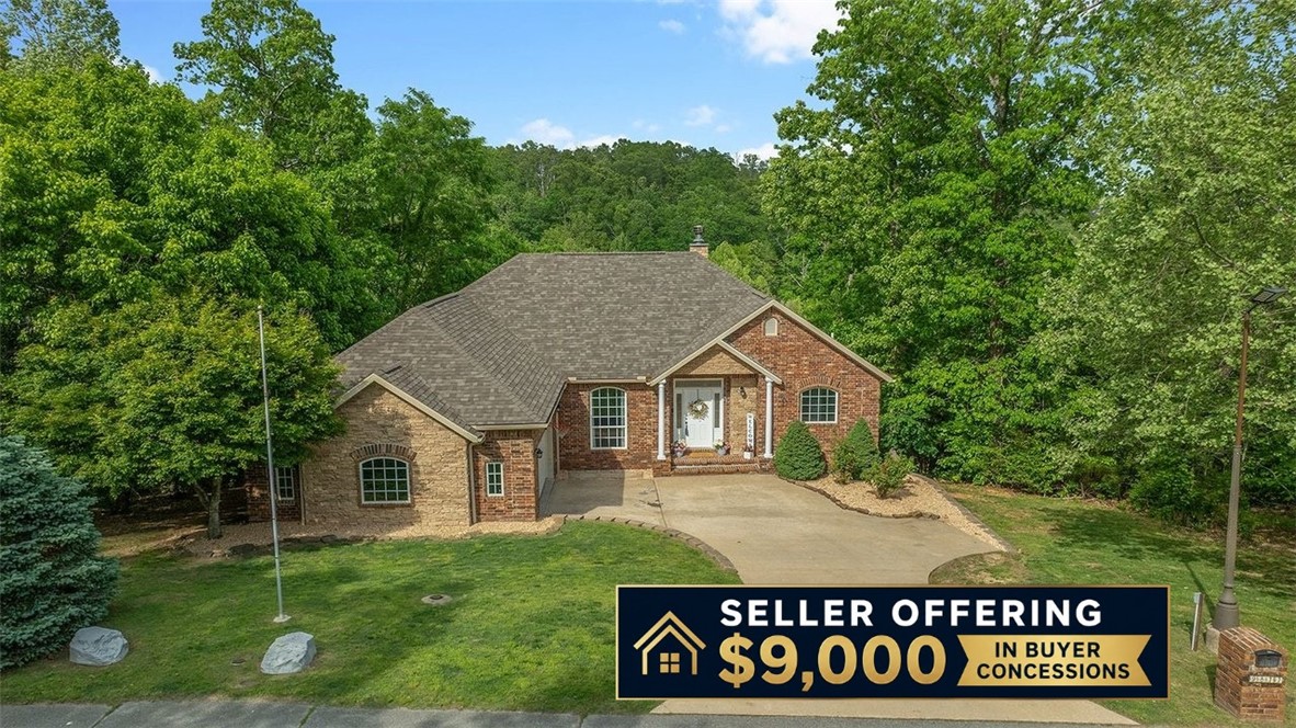 Tucked away in a private, gated community surrounded by natural wooded beauty, this stunning home offers the perfect blend of seclusion and convenience. Enjoy a peaceful, country-like setting while being just 3 minutes from downtown Rogers and only 5 miles from Prairie Creek Marina. This beautifully updated home features hand-scraped wood floors, granite countertops throughout, and upgraded lighting fixtures that elevate the space with a modern touch. Recent exterior improvements include new architectural shingles and new gutters, providing both style and peace of mind for years to come. Take in the serene, seasonal lake views and unwind in a setting that truly feels like a retreat. With its ideal location close to dining, shopping, and outdoor recreation, this home offers the best of both worlds—privacy and accessibility. Don’t miss the opportunity to own a home where comfort, quality, and location come together seamlessly. Pics with furniture are virtually staged.