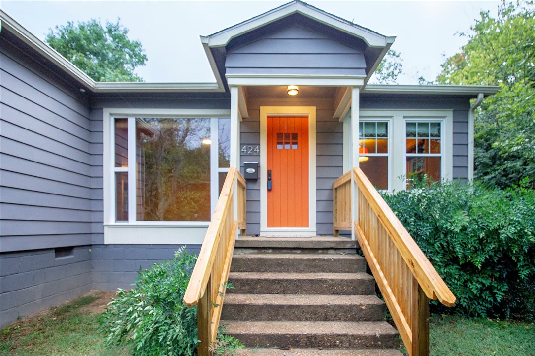 Washington-Willow neighborhood home-1940's with original hardwood, huge basement, and renovated. New fence, new back deck, new front porch, new garage doors, new drainage system, and newly surveyed all in 2018. Sewer/water supply less than 6 years old. Swepco program sealed ducts and added insulation for energy efficiency. Roof, electrical, kitchen and bath remodels in 2010. Walk/bike to Dickson Street, U of A, The Farmers Market, and Wilson Park! Fridge conveys.