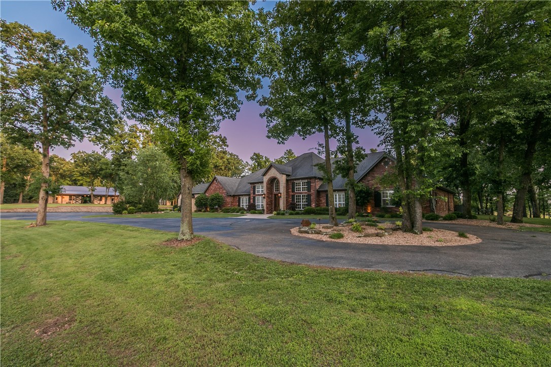 Private 24 acre Bentonville Estate and Builder's personal home located on stunning hilltop setting!  Long winding private driveway leads to the 6800 sfeet estate home on one level, 7BRs, 5.5 Baths.  A True gourmet chef's kitchen like no other!  Featuring Double Islands, SubZero Refrigerator, Wolf Commercial Grade Appliances.   Saltwater pool, Media Room, Exercise Room, Study.  Detached 4 car garage and 60 x 60 horse barn with workshops.    Full spec sheet of whole house amenities and upgrades available upon request.   Shown by Appointment Only.