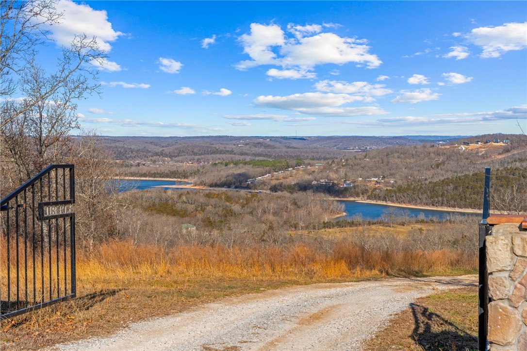 WHAT A VIEW!! Beautiful 2-acre vacant land parcel in Omaha, AR offering stunning lake views and sweeping panoramic scenery. This fantastic property provides the freedom to build your dream home, vacation retreat, or STR investment property! Enjoy peaceful surroundings with easy access to Highway 65 and a convenient location just 15 minutes from Cricket Creek Marina, Big Cedar Lodge, Top of the Rock, and Thunder Ridge Nature Arena, and only 25 minutes to Branson. An optional 12 x 30 boat slip is available for an additional cost and is located in a 3-year-old dock featuring durable concrete decking--perfect for enjoying lake life and outdoor recreation. Rare opportunity to own scenic acreage with flexibility and accessibility--don't miss it.