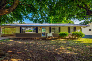 Home being sold AS IS. 3 bedroom; 2 bathroom home in established neighborhood. This home features many modern updates with a vintage charm! The main level features 3 bedrooms & 1 full, newly remodeled bath. Walkout basement area is currently being used as a 4th bedroom & has a full bathroom. Could be converted into a game room/ movie room area! Unfinished portion of basement contains utility area with W/D hookups. Basement also contains large storage area. Original W/D hookups remain upstairs as well, but current owners are using space for refrigerator. New main plumb lines in 2020! Metal roof approx 5 years old! Seasonal mountain views.