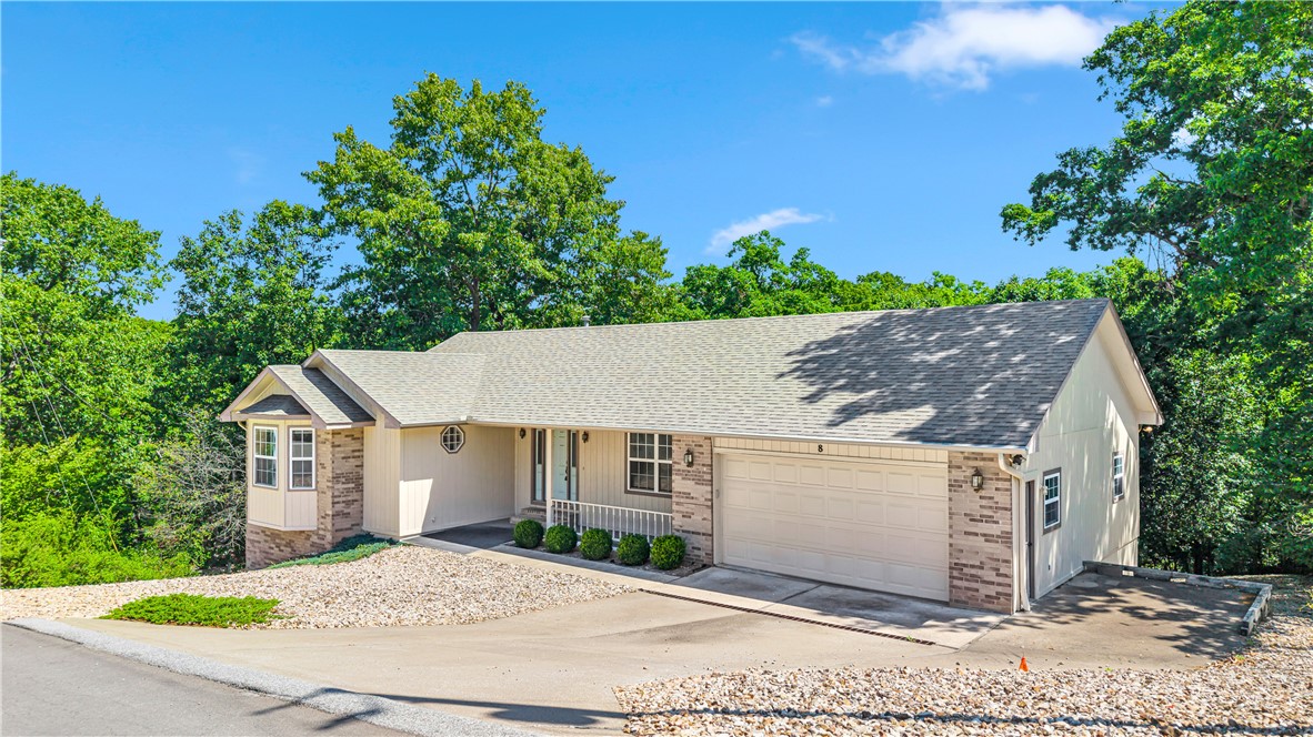 Welcome to one of Bella Vista's best-kept secrets — a beautifully maintained 3-bedroom, 3.5-bath ranch that checks every box! This 2,770 sq ft home sits on a professionally landscaped lot and features a cozy gas fireplace, split floor plan, walk-in closets, and a finished walk-out basement with workshop. The covered deck and patio are perfect for entertaining. You're just minutes from Loch Lomond Marina and the iconic Lakepoint Restaurant, making lakeside living effortlessly accessible. As a Bella Vista POA member, enjoy world-class amenities including pools, tennis courts, championship golf courses, fitness facilities, scenic trails, and multiple lakes. The attached 2-car garage, updated appliances, and architectural shingle roof add everyday convenience — all for a remarkably low monthly POA fee. This is the Bella Vista lifestyle at its finest. Don't miss this gem!