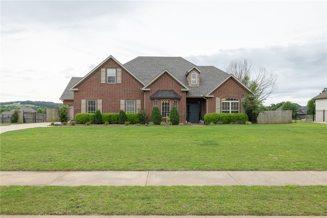 Awesome opportunity to live in East Fayetteville’s gated Waterford community with PRIVATE in-ground pool!!   3,825 heated and cooled sq ft offers 4 bedrooms, full and 1 half bathrooms, study, formal dining, oversized living, eat in kitchen, separate laundry, and a bonus room!! Amenities include hardwood floors, pot filler, all bedrooms are on-suites, full tile surround showers,  in ground basketball goal, a fully privacy fenced backyard, NEW ROOF in 2026 and a 3 car garage.  The pool is a 20 x 38’ DIVING pool that has a gas heater and a tanning ledge.  Community amenities include White River access, fishing ponds, a clubhouse, and community pool. Zoned for Vandergriff Elementary and Woodland Junior High.  This is a lot of living space for the money!!!!