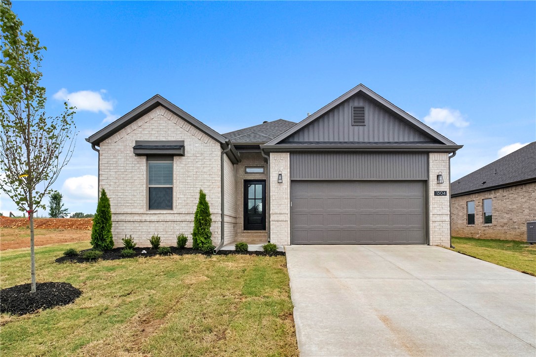 Welcome to Savannah Park, Highfill's newest community! The “Arlington” Floor Plan offers 3 BD, 2 BA, and thoughtfully designed living spaces featuring vaulted ceilings and LVP flooring throughout the home - no carpet! Enjoy stylish finishes including quartz countertops, designer lighting, a modern electric fireplace, and a covered back patio. The primary suite is designed with comfort in mind, featuring an oversized vanity, walk-in closet, and a floor-to-ceiling tiled walk-in shower. Situated on a 0.16-acre lot, this home provides plenty of outdoor space to enjoy summer evenings & weekend gatherings. Additional standard upgrades include impact-resistant roof shingles, insulated garage walls and garage doors, 2-inch faux wood blinds, and a full home guttering system. Located in the growing community of Highfill, you'll enjoy easy access to nearby restaurants, coffee shops, and everyday conveniences. Just 7 min from XNA Airport, 15 min to Cave Springs, and less than 30 min to the new Walmart Home Office. Tour today!