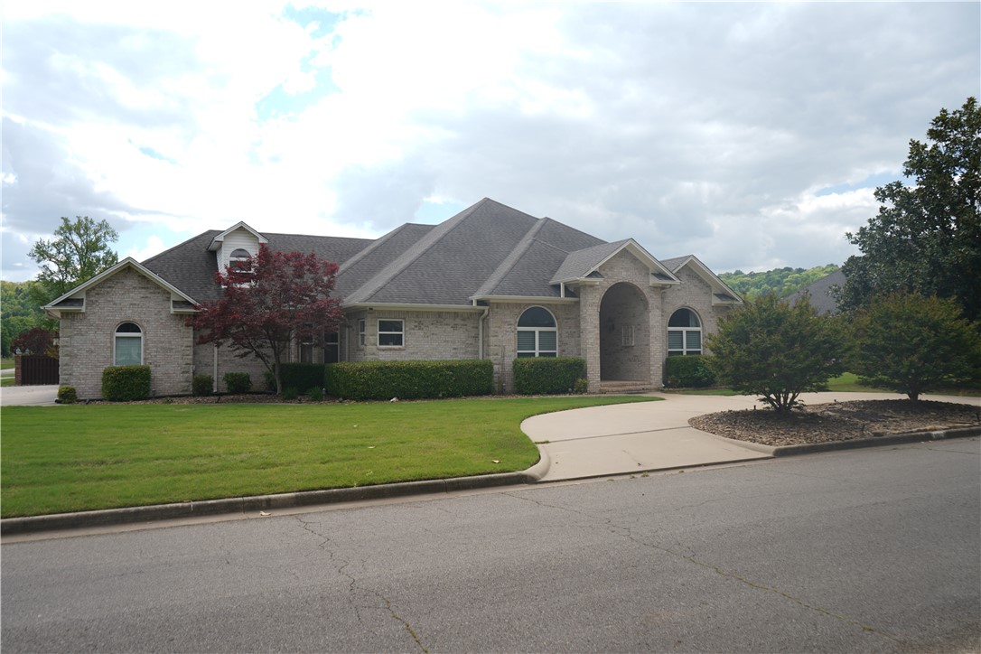 Brookside Estates.  Step into comfort, space and style with this exceptional home located in one of Russellville most desired neighborhoods.  From the moment you arrive, the circular drive with extra parking and the beautifully sprinkled maintained landscaping set the tone for what's inside.  This spacious homes offers 4 bedrooms, three full baths, two half baths, providing plenty of room for family and guest.  The oversized master suite features a huge walk in closet with a luxurious jacuzzi tub in the bath.  Upstairs adds an additional 1100 square feet perfect for game room, office, or extra living area.
The main living space is warm and inviting with a fireplace that anchors the room, while modern comforts like security system and built in outside speakers add both convenience and entertainment value.  The kitchen and living areas flow seamlessly for everyday living and hosting gatherings.  
The backyard provides an awesome patio with fire pit and sitting area not far away.  
Schedule your showing today.