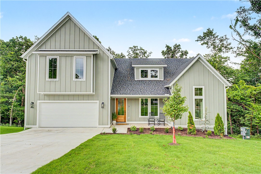 This new home has many upgraded features.   The open concept with vaulted ceilings, fireplace and loads of windows bring nature into your living room.  Nicely appointed kitchen has quartz counters with waterfall design, designer drop lighting over the bar makes a statement ,tile backsplash, built in microwave, loads of extra counter and cabinets for storage. The large sink has a window overlooking backyard & patio. The master suite truly feels like a private retreat with the adjoining bath with dual sinks, soaking tub, and beautiful walk-in shower.   Upstairs are 2 bedrooms ,private office,+ bonus area, and a large full size well-appointed bath.